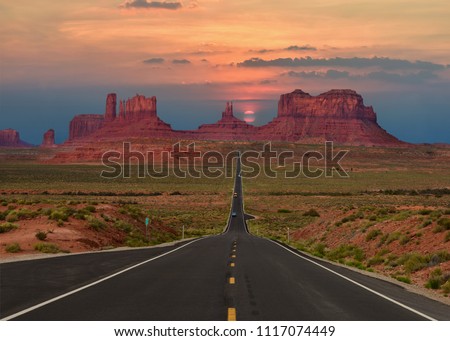 Scenic highway in Monument Valley Tribal Park in Arizona-Utah border, U.S.A. at sunset. Royalty-Free Stock Photo #1117074449
