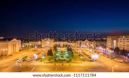 The building of the railway station in the post-Soviet city. Night view of the city and square.