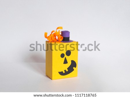 Pumpkin of paper on a white background. Funny pumpkins in caps and caps. Party for Halloween. Creativity with children.