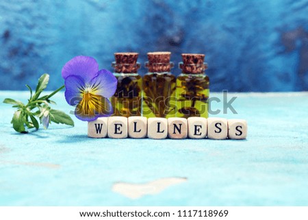 Wellness sign with wooden cubes on vintage background