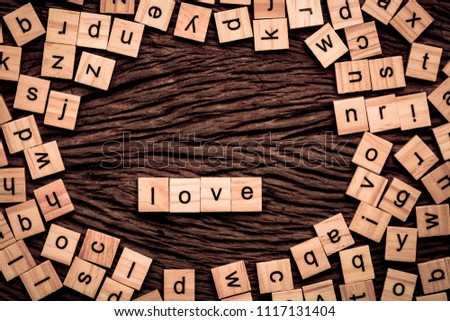 Love word written cube on wooden background. Vintage concept.