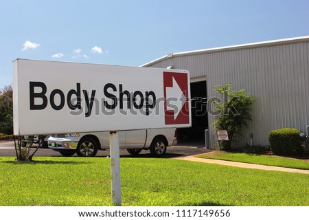Body Shop Sign at Car Dealership  Royalty-Free Stock Photo #1117149656