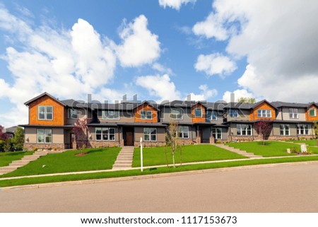 Brand new row of townhomes for sales in North American suburban neighborhood