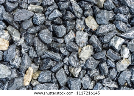 Small rocks or gravel made from  stones different shape as stone texture. Used for construction of buildings and roads and
as a building material.
