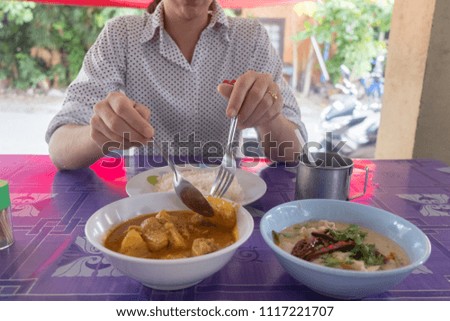 red curry and tom ka gai in street food restaurant.