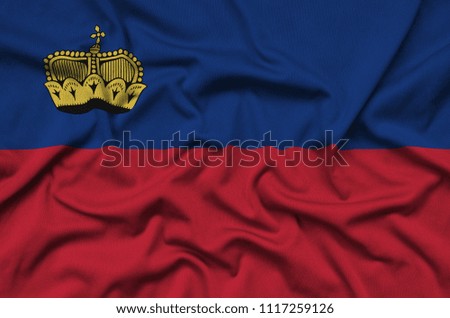 Liechtenstein flag  is depicted on a sports cloth fabric with many folds. Sport team banner