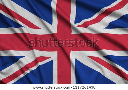 Great britain flag  is depicted on a sports cloth fabric with many folds. Sport team banner Royalty-Free Stock Photo #1117261430