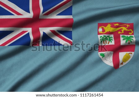 Fiji flag  is depicted on a sports cloth fabric with many folds. Sport team banner