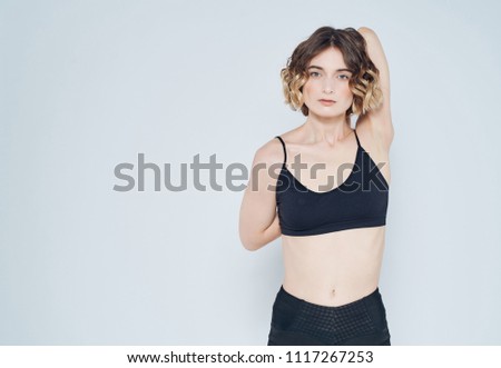 attractive woman with a slender figure behind her back