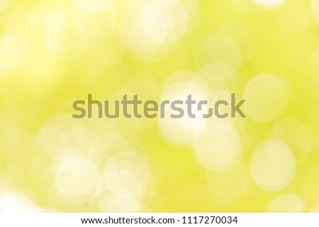 Abstract blurred yellow bokeh background from natural