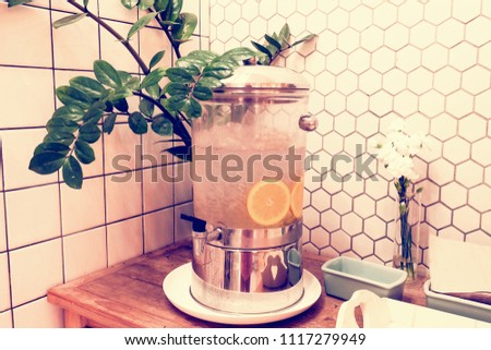 Orange or fruit infused water in a pitcher.