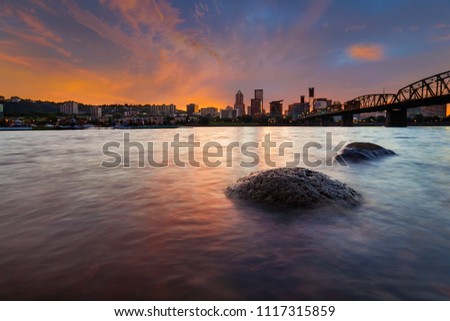Portland Oregon downtown city skyline along Willamette River at Sunset