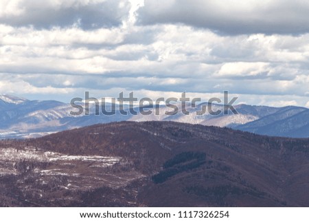 A picturesque view of the Carpathian Mountains in Ukraine. High peaks in the snow