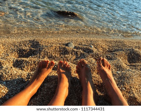 Girls feet at the beach