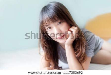 Beautiful Asian women in the bedroom