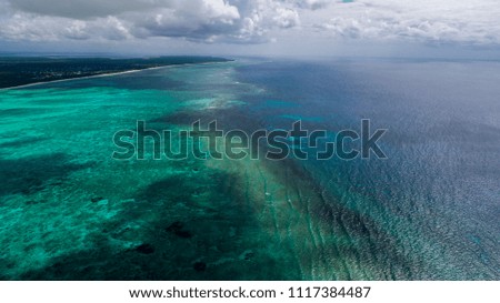 Top view or aerial view of Beautiful clear water with long tail boats or kite surfing