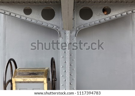 Closeup of details of the deck of a steam warship of the early 20th century. Support bridge with rivets.