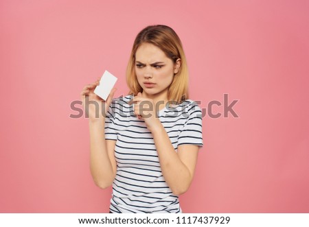 woman with disgust looks at the badge                              