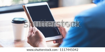 Man using the digital tablet in the morning for Searching Browsing Internet Data Information Networking Concept.