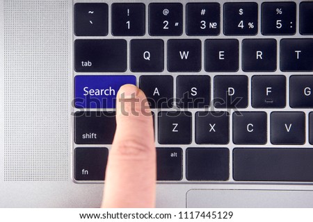 business concept shows as well as the fingers that press Search on the keyboard