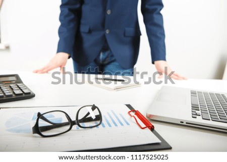 businessman working alone in the office. Cropped image of male accountant working with papers