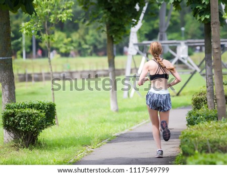 Young woman jogging in the park
