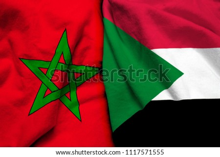 Morocco and Sudan flag on cloth texture