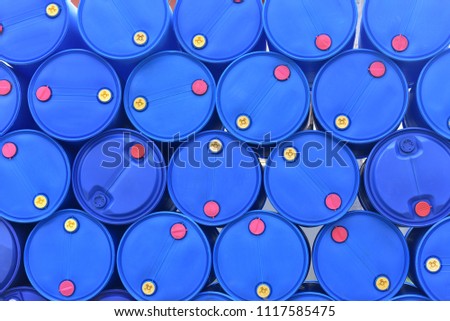Close up top view of big blue plastic tank or empty gallon stacked, big drum use for gasoline, chemical, fuel. Royalty-Free Stock Photo #1117585475