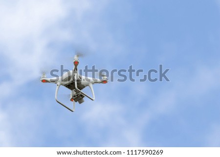 Drone with digital camera. Flying camera take a photo and video.