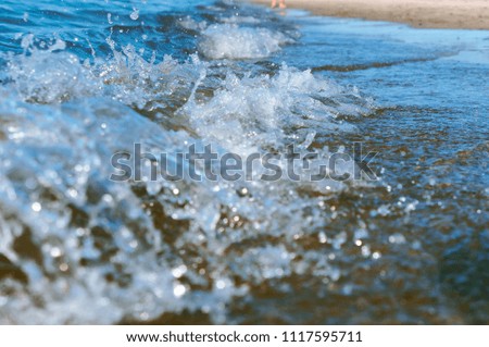 sea water foam, sea wave, the excitement on the shore sea, the water is boiling