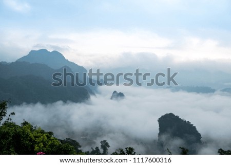 Mountains in the morning with fog and morning light.