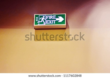 Background of wooden wall with sign of fire exit, have space for copy