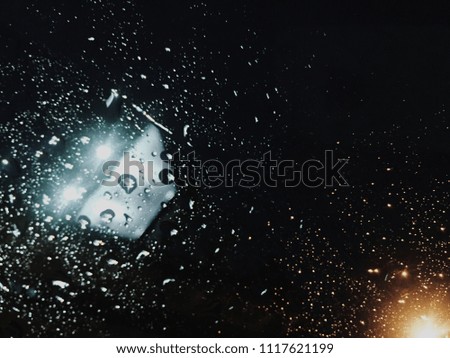 Rain drop on grass with two tone light in concept lonely feeling