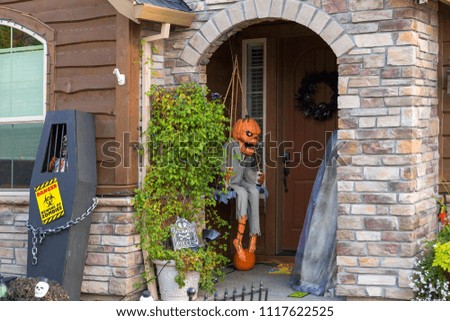 Halloween decoration on house front door entrance in North American suburban neighborhood