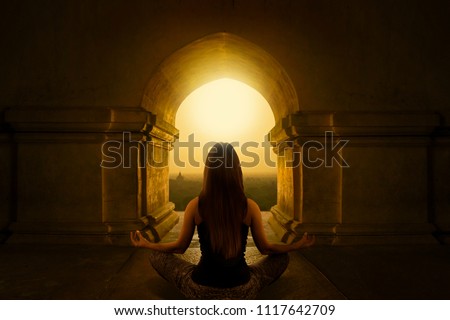 Woman with yoga pose in buddhist temple Royalty-Free Stock Photo #1117642709