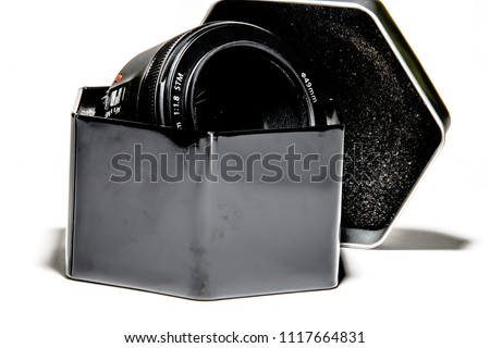 Camera lens in metal box