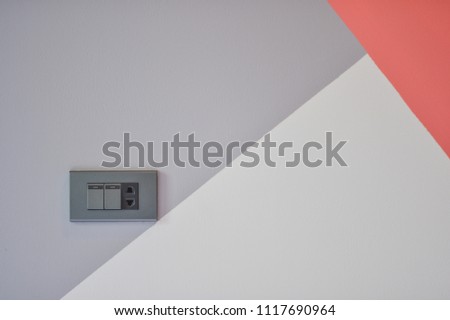 Switches and plugs with colorful wall background