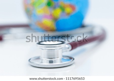 Stethoscope and world map. Image use for health medical care of people concept.