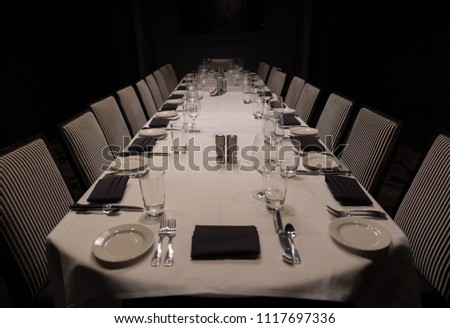 Evening Dining table set and ready to host guests for dinner Royalty-Free Stock Photo #1117697336