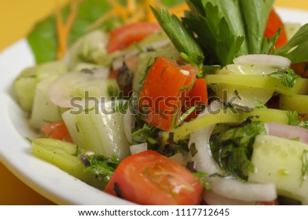 salad of cucumber, tomato, pepper and onion