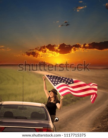 Young woman holding waving American USA flag. Independence Day or traveling in America concept.