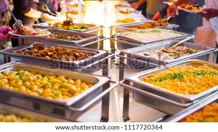 People group catering buffet food indoor in luxury restaurant with meat colorful fruits and vegetables. Royalty-Free Stock Photo #1117720364