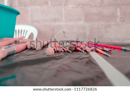 Close up photograph of red color effect paintbrushes background 