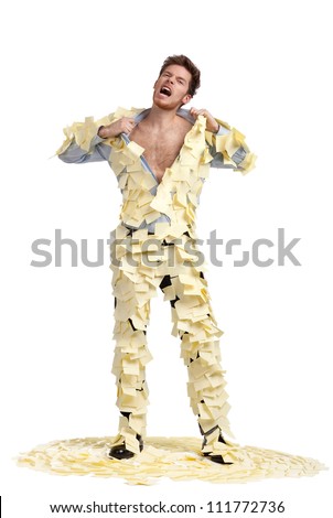A young man ripping off his shirt, covered with stickers, isolated on white, full-length portrait