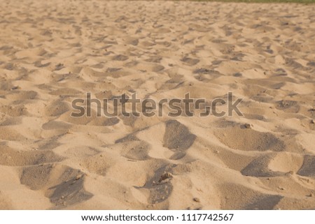 Closeup of sand pattern of a beach in the summer. Background.concept for summer season.