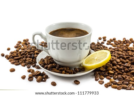 Cup of coffee with lemon and grains isolated on white Royalty-Free Stock Photo #111779933