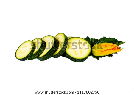 Fresh green zucchini with slices isolated on white background.