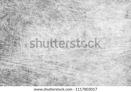 Black scratched texture on a white background. Background with black lines in all directions.