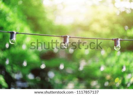 Light bulb decor in outdoor party,warm tone