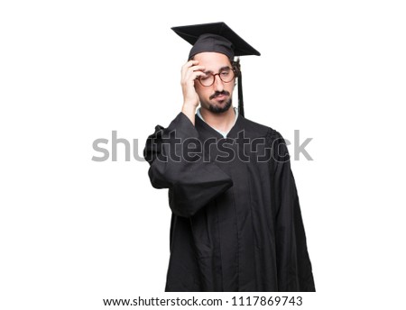 graduate bearded man Looking unenthusiastic and bored, listening to something dull and tedious, yawning in utter boredom.
